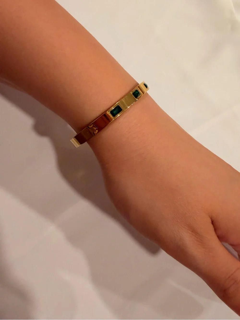 Gold Bangle with Emerald Green Accents